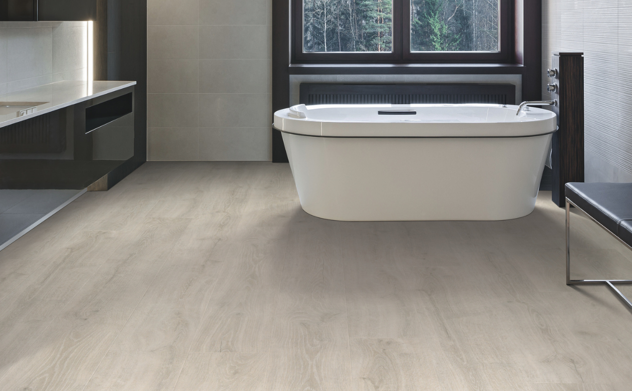 Bathroom with laminate flooring and free-standing tub