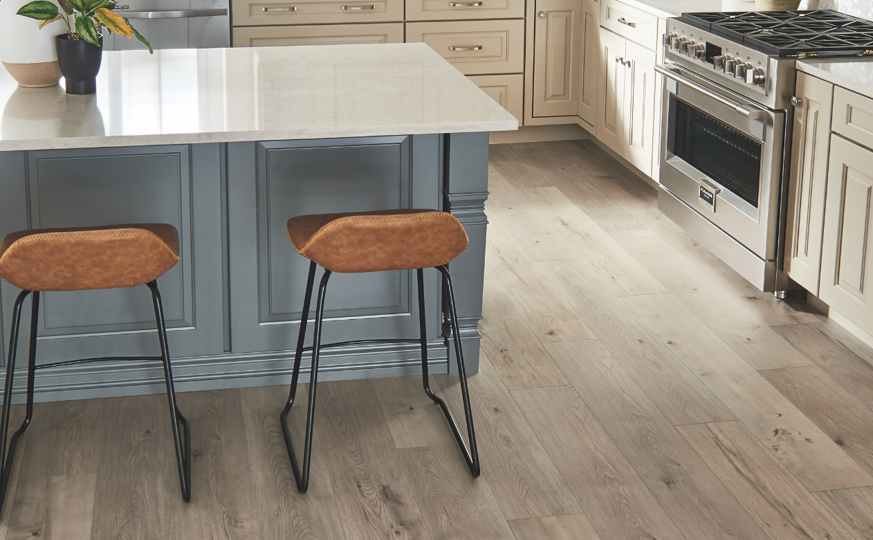 Laminate flooring in a kitchen with leather barstools